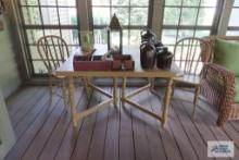 rustic painted table with two plank bottom chairs