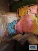 Crocheted baby clothes, blankets, and etc