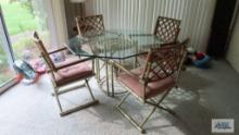 Brass...and bamboo glass top table...and four chairs