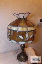 Leaded glass table lamp with metal base. Shade is cracked