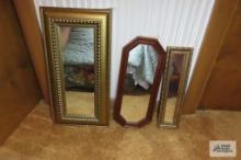 Three small mirrors. The tallest one is 19 in tall by 9-1/2 in...wide.