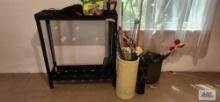 Umbrella stand, brass container, reflectors, and garden tools rack