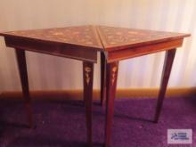 Pair of mahogany hand inlaid Reuge music box tables, made in Italy. One has damage to inside.