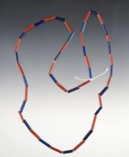 20" Strand of red and blue tubular beads. Recovered at the Dann Site in Lima, Monroe Co., NY.