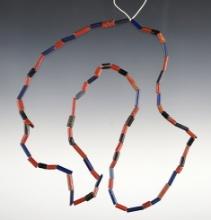 24" Strand of red, black and blue tubular beads. Dann Site in Lima, Monroe Co., New York.