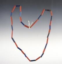 17" Strand of red and blue tubular beads. Recovered at the Dann Site in Lima, Monroe Co., NY.