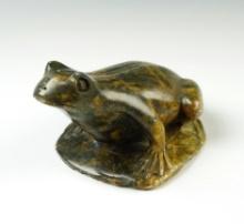 4 1/2" long x 3" wide beautiful stone carving depicting a frog, signed on bottom by artist.