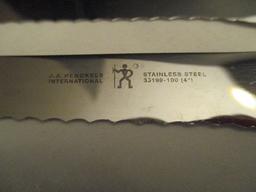 Eight J A Henckels Stainless Knives