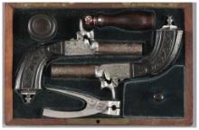 Cased Pair of Engraved European Percussion Muff Pistols