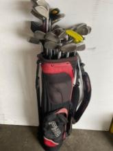 Ping golf bag and 30 assorted golf clubs