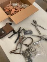 Lot. Miscellaneous leather punches, bag, medallions, etc