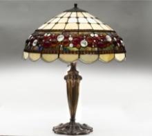 Fancy Table Lamp with jeweled shade that measures 20" diameter, heavy embossed cast iron base. Lamp