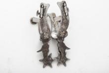 A pair of Russell Yates double mounted Spurs, #244, with copper and silver floral hand engraved over
