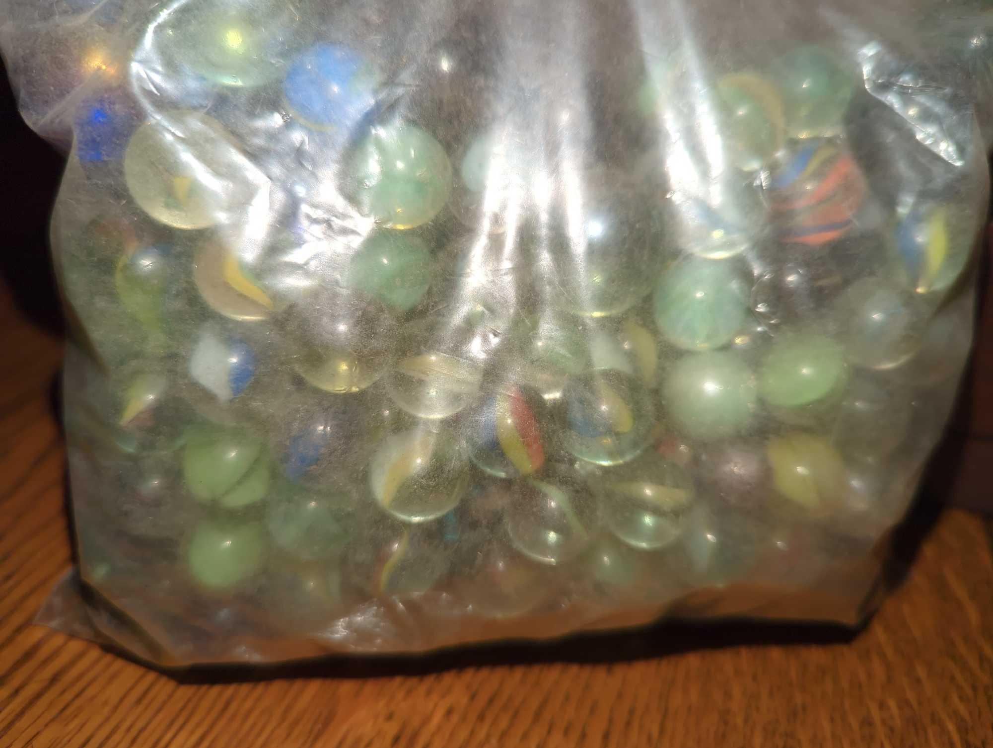 (DR) LOT OF ASSORTED CONTAINERS CONTAINING ASSORTED TYPES OF MARBLES, WHAT YOU SEE IN THE PHOTOS IS