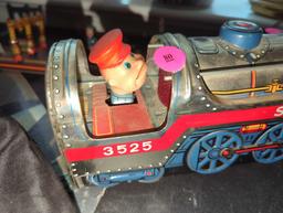(LR)BATTERY OPERATED TIN TOY, SILVER MOUNTAIN LOCOMOTIVE WITH OPERATOR, UNTESTED, IN GOOD CONDITION.