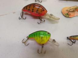 Tackle Box and contents including various fishing lures of similar style. Comes as is shown in