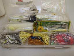 Mini tackle box and small white bin consisting of various fishing lures and other fishing