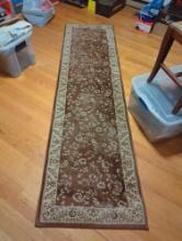 (LR) 26 1/4"X95" FLORAL MACHINE MADE AREA RUG, BROWN AND CREAM.