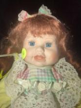 (GAR) Soft Expressions Porcelain Doll with Red Hair and Blue Eyes Wearing a Yellow/Red/Green Dress