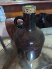 (GAR) BROWN GLASS WHISKEY STYLE JUG WITH LID, WHAT YOU SEE IN PHOTOS IS WHAT YOU WILL RECEIVE SOLD