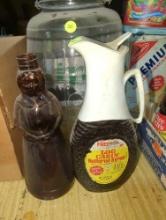 (GAR) LOT OF 2 ITEMS TO INCLUDE, ONE EARLY STYLE GLASS MRS. BUTTER WORTH'S SYRUP BOTTLE AND A LOG