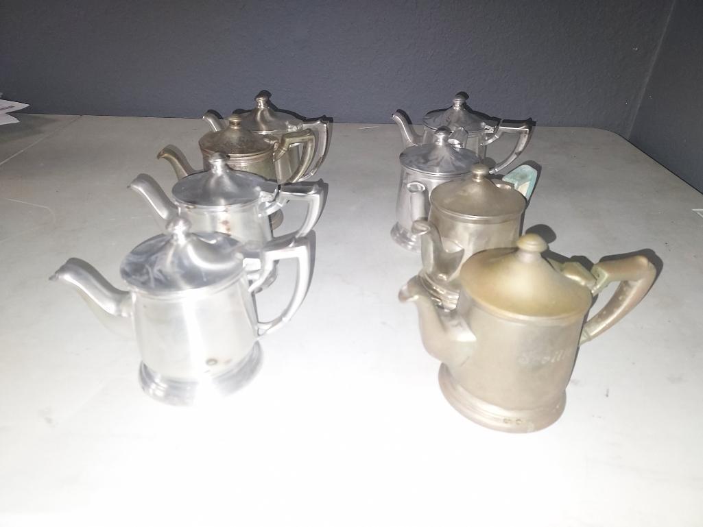 Eight Vintage King Cole International Silver Syrup Pitchers