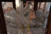 SHELF LOT INCLUDING CUT GLASS BASKETS SERVING DISHES HONEY AND SALT JARS AN