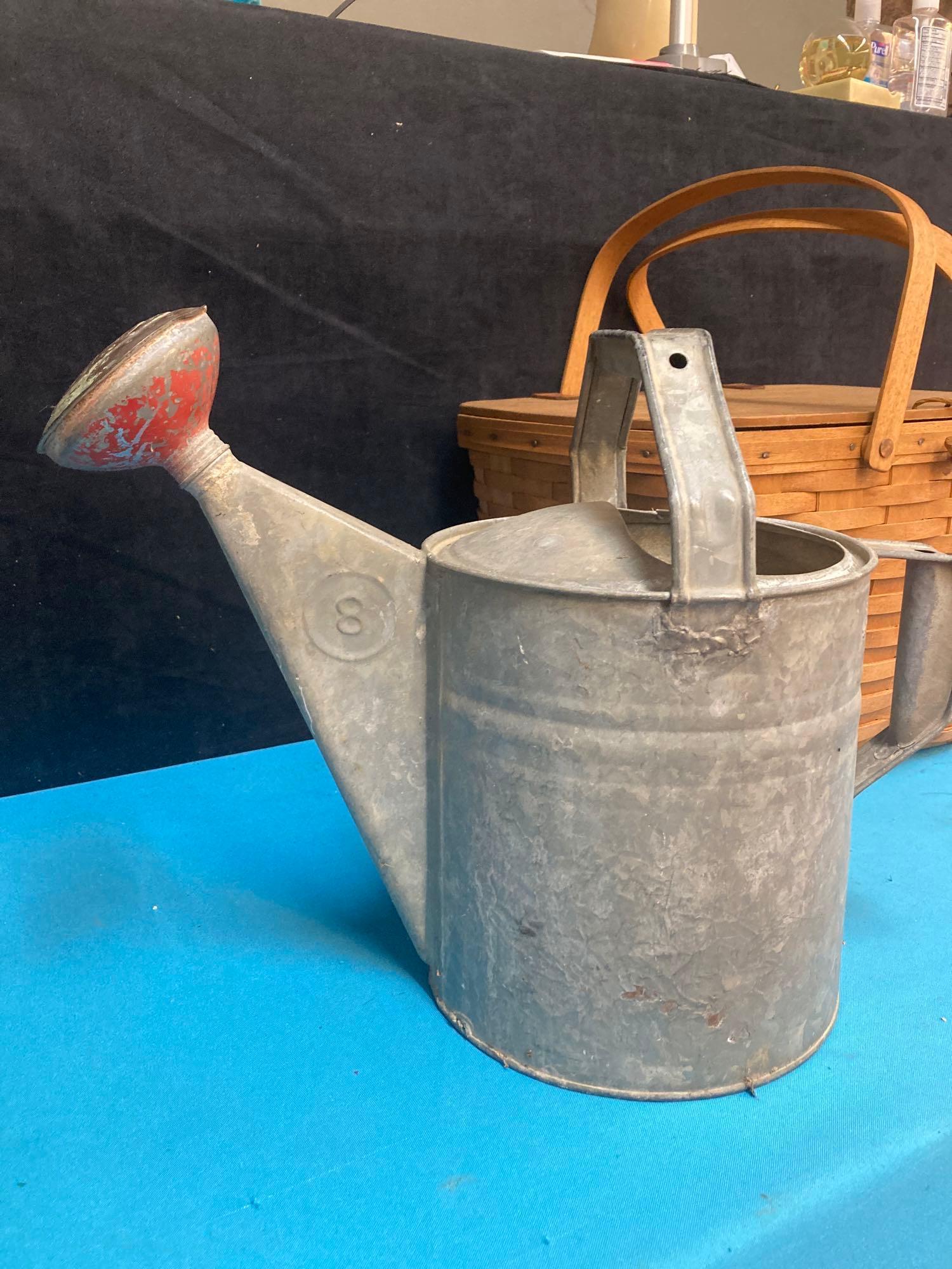 Galvanized watering can and Longaberger picnic basket