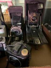 five vintage cameras, Kodak Polaroid video light