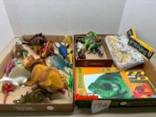 Collection of dinosaurs figures books etc.