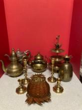 Nice brass lot including teapots, pineapple items, candle sticks