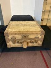 large vintage luggage case filled with cast-iron and metal tools