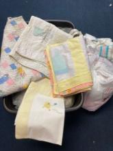 Tote full of vintage baby linens