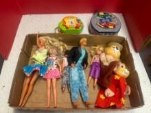 Barbie dolls, chipmunk dolls, Sesame Street toy, and Mickey Mouse racing tin