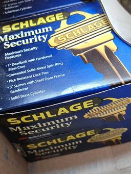 (2) boxes of Schlage locking door knobs, handles