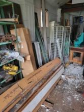 Large lot of shelving, racks, lumber, folding tables and more