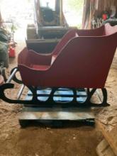 Red and black painted wood sleigh