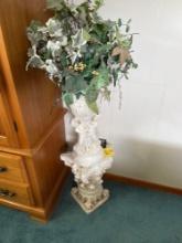 Vase statue with faux plants