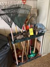 Yard tool holder with shovels, rakes, axe, sledge hammer
