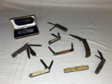 assortment of small pocket knives