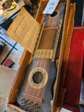 Ukelin string instrument, original box and paperwork