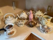 Tea pots, coffee pot, standing boy straw holder