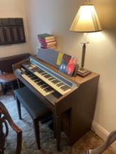 Hammond electric organ, lamp, books on top