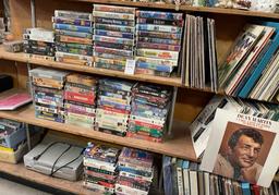 shelf vhs tapes and vinyl records