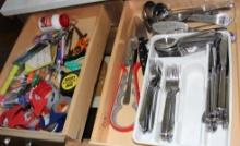 Contents of Kitchen Island Drawers Including Utensils and Utility Items