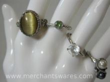 Four Costume Jewelry Rings in assorted sizes