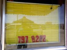 Yellow 3' x 3' Letter Sign in Front Window