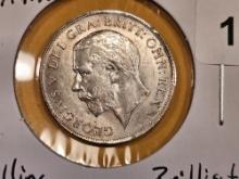 1911 Great Britain silver shilling in Brilliant About Uncirculated plus