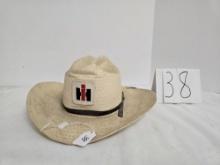 white IH woven cowboy hat size 7 1/8 small amount of black tar on back