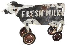Folk Art Dairy Sign, two-sided painted torch cut steel cow on coaster wagon